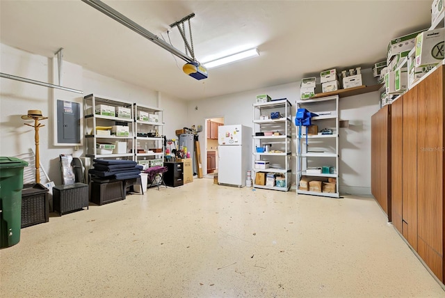 garage with white refrigerator, electric panel, a garage door opener, and water heater