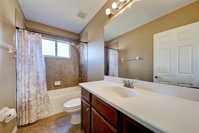 full bathroom with tile patterned floors, vanity, shower / tub combo, and toilet