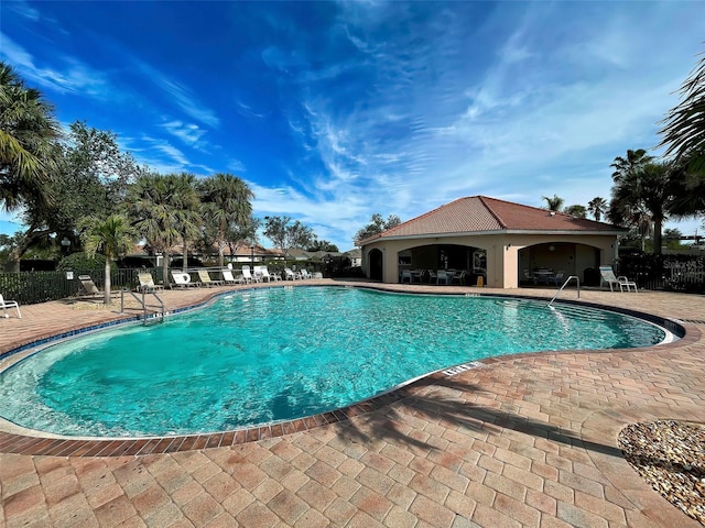 view of swimming pool featuring a patio area