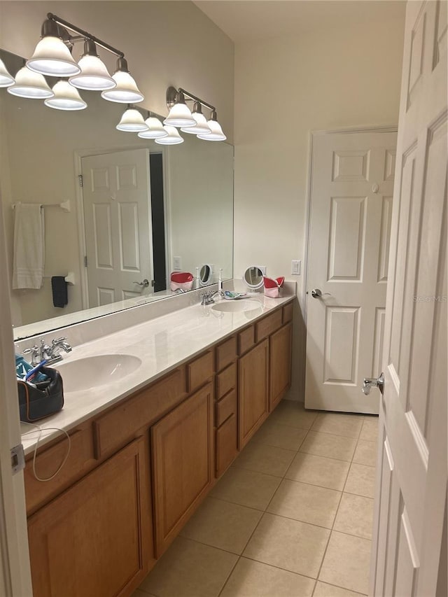 bathroom with tile patterned flooring and vanity