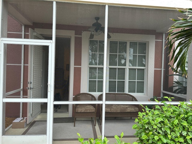 property entrance featuring ceiling fan