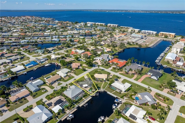 birds eye view of property featuring a water view