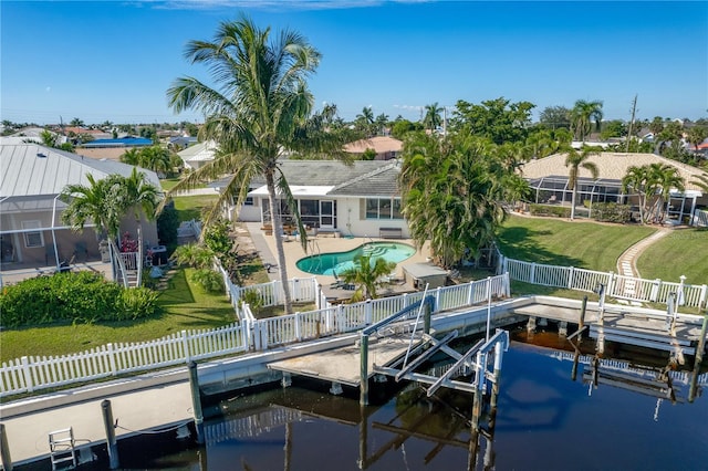 view of dock featuring a patio area, a water view, and a fenced in pool