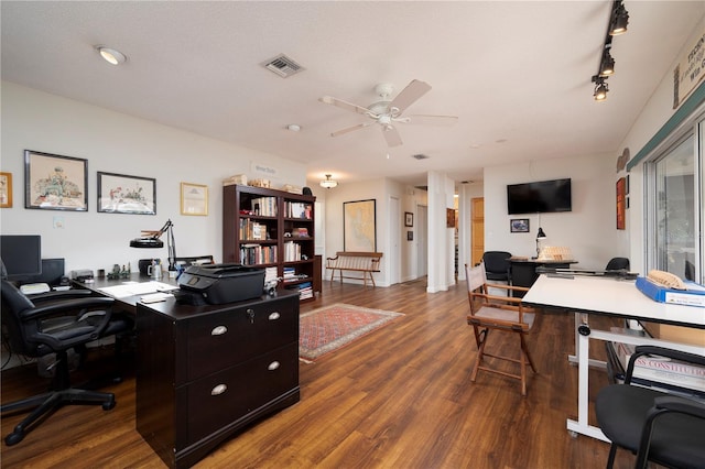 home office with hardwood / wood-style floors, rail lighting, a textured ceiling, and ceiling fan