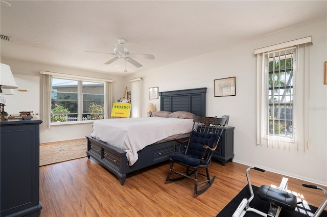 bedroom featuring ceiling fan and light hardwood / wood-style floors