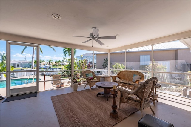 sunroom with ceiling fan