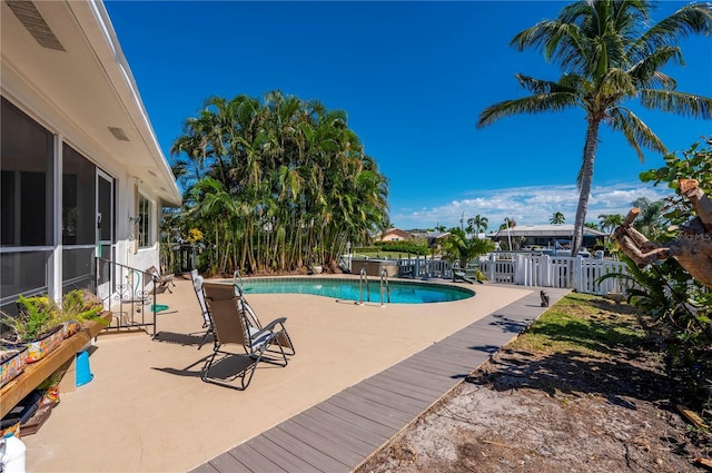 view of swimming pool featuring a patio