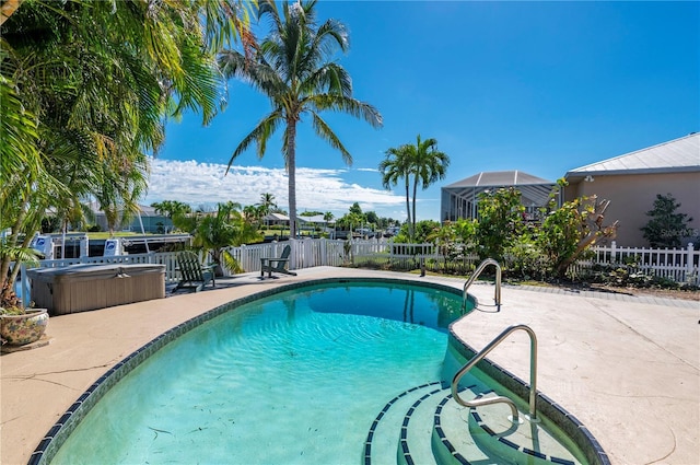 view of swimming pool with a patio