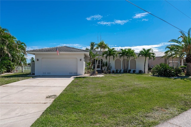 single story home with a garage and a front yard