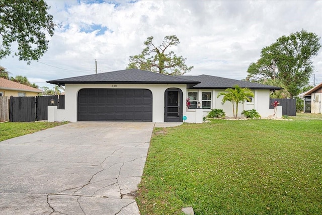 single story home featuring a front yard and a garage