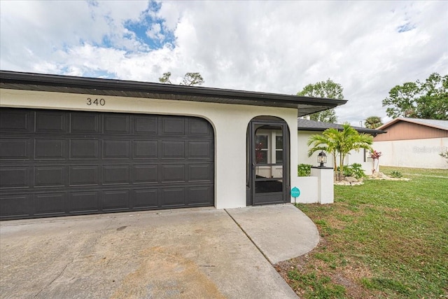 garage featuring a lawn