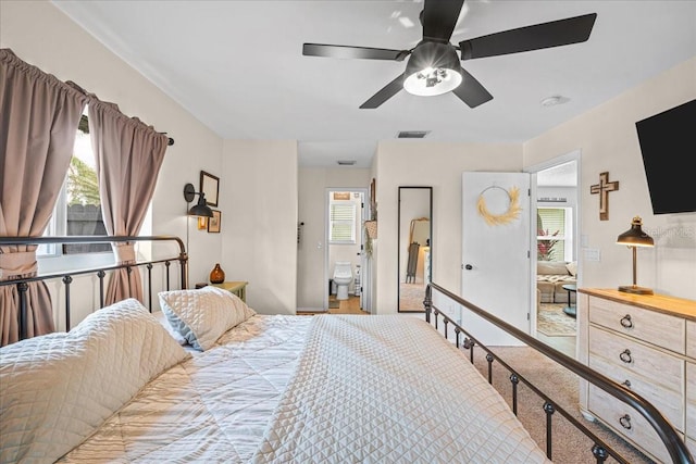 bedroom with a ceiling fan, visible vents, and carpet flooring