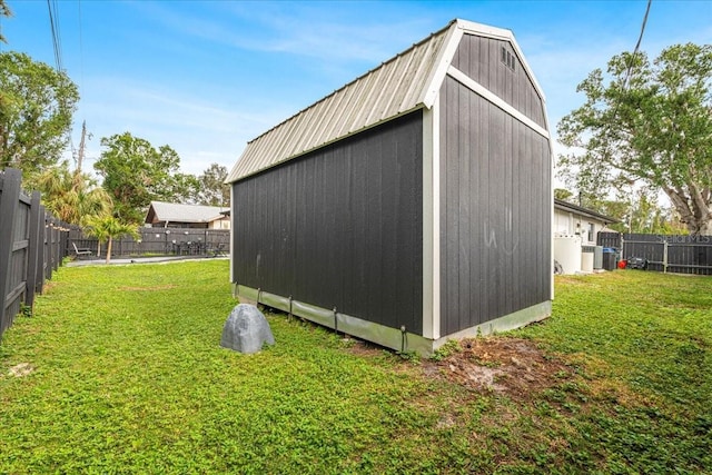 view of outdoor structure with a lawn