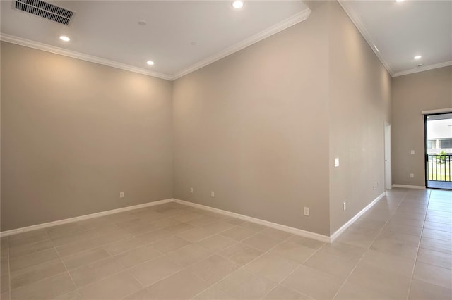 tiled spare room with crown molding