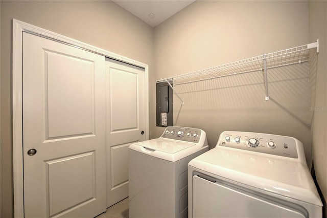 washroom featuring independent washer and dryer and electric panel