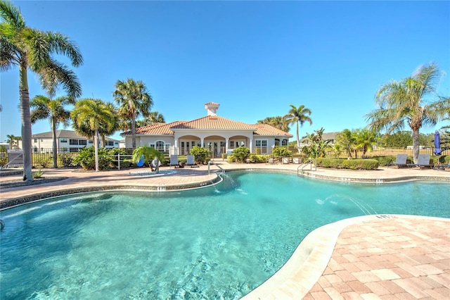 view of swimming pool with a patio