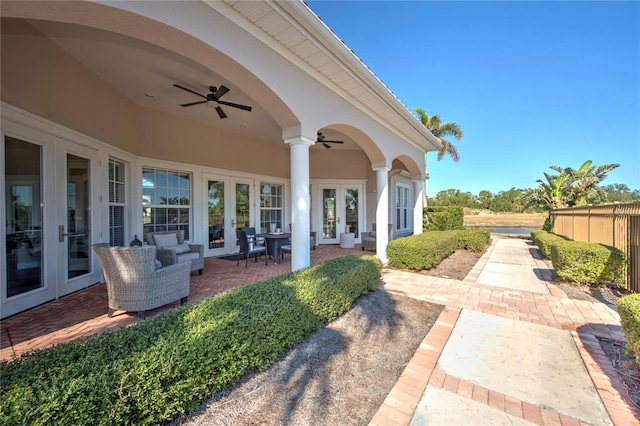 view of patio with ceiling fan and french doors