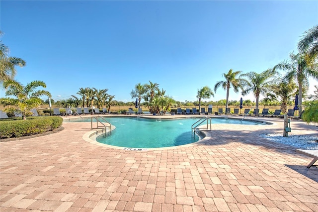 view of swimming pool with a patio area