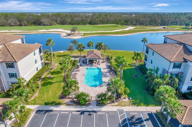 birds eye view of property with a water view