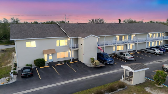 view of outdoor building at dusk