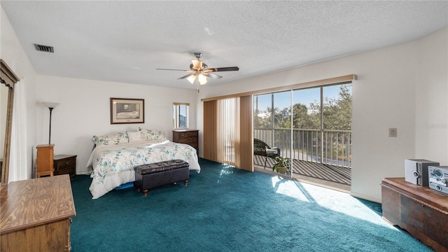 carpeted bedroom featuring access to exterior, a textured ceiling, and ceiling fan