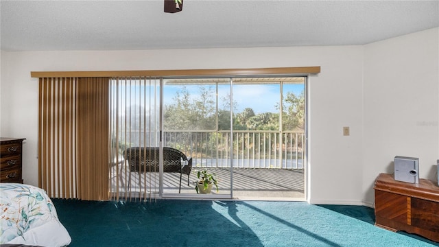 bedroom featuring carpet and a textured ceiling