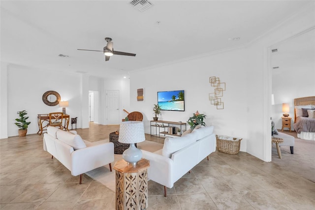 living room with ceiling fan and crown molding