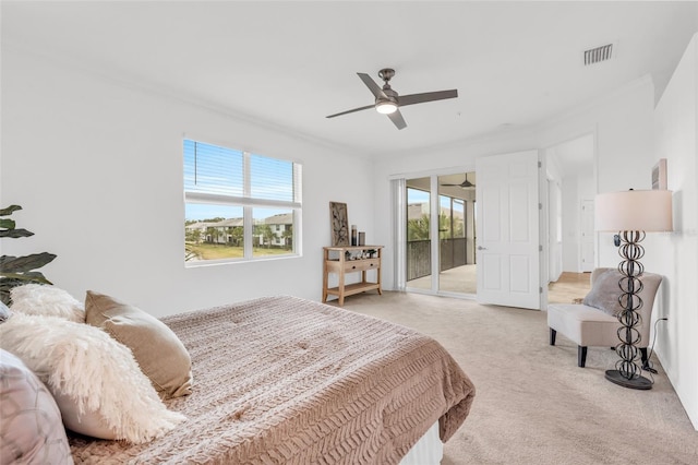 carpeted bedroom featuring access to outside, ceiling fan, and crown molding