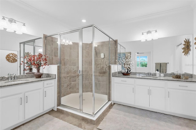 bathroom with an enclosed shower, vanity, tile patterned floors, and crown molding