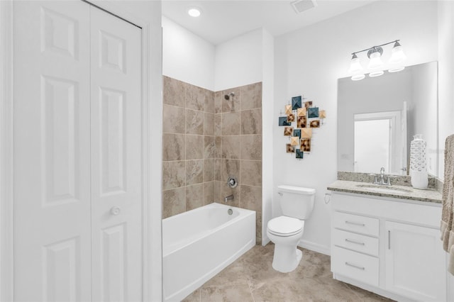 full bathroom with toilet, tiled shower / bath, and vanity