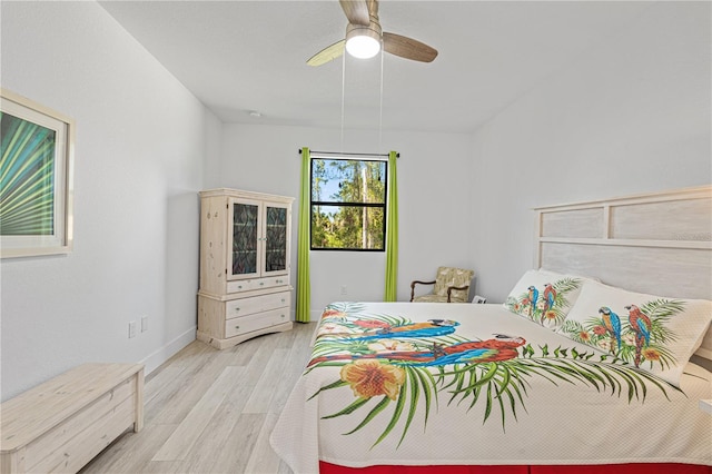 bedroom with ceiling fan and light wood-type flooring