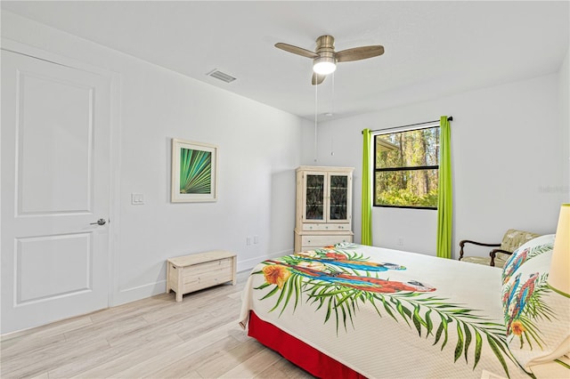 bedroom with light hardwood / wood-style flooring and ceiling fan