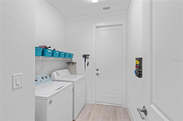 laundry room with washing machine and dryer