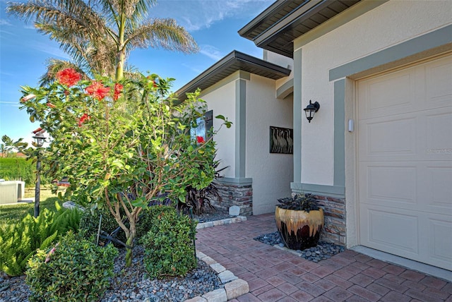 doorway to property featuring a garage