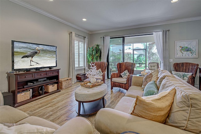 living room featuring light hardwood / wood-style flooring and ornamental molding