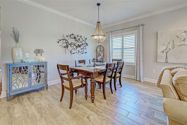 dining area featuring a notable chandelier and ornamental molding