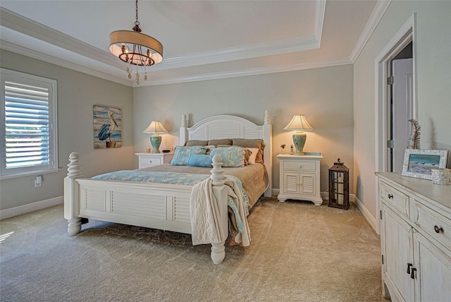 carpeted bedroom with a raised ceiling and crown molding