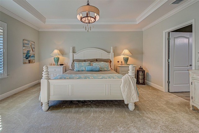 carpeted bedroom with a raised ceiling, crown molding, and an inviting chandelier