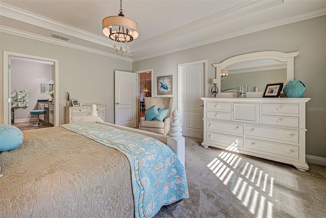 bedroom featuring a chandelier, light colored carpet, a tray ceiling, and crown molding