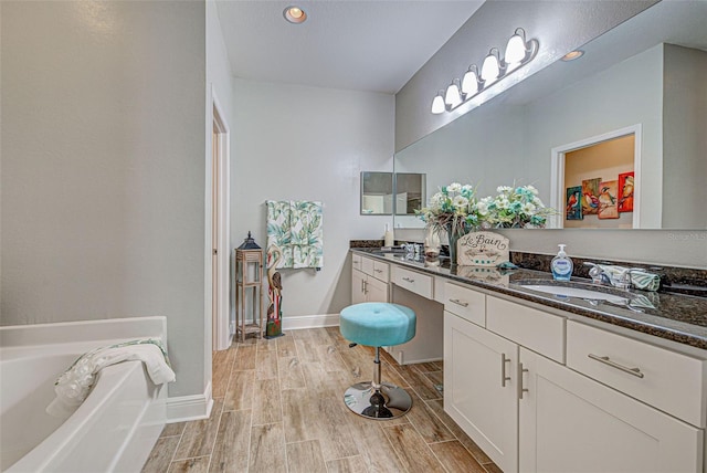 bathroom with a bathtub and vanity