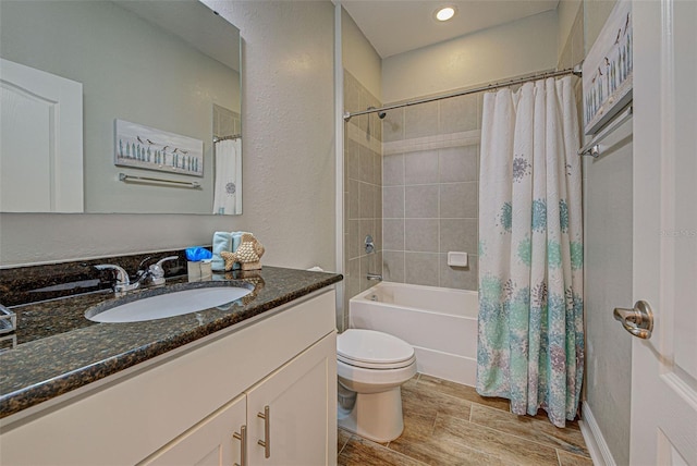 full bathroom featuring vanity, toilet, and shower / bathtub combination with curtain