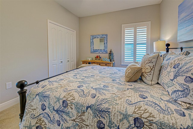 carpeted bedroom with a closet