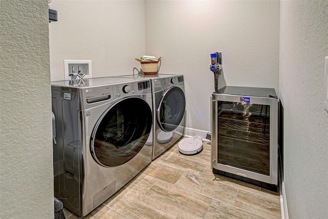 laundry area featuring washer and clothes dryer and beverage cooler