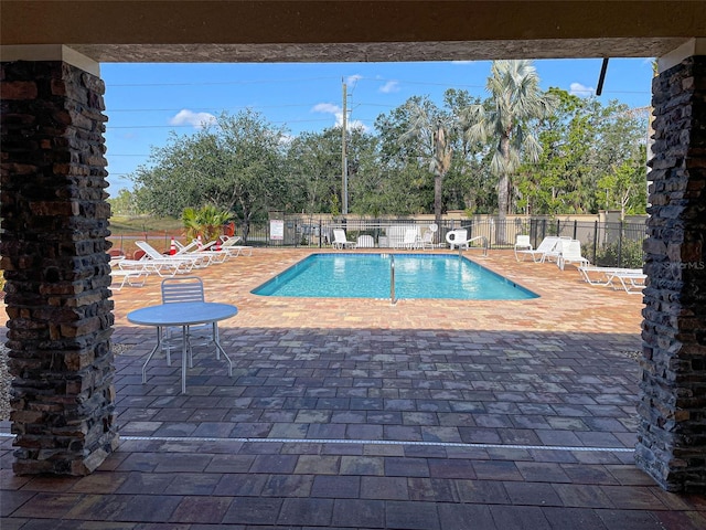 view of pool featuring a patio area