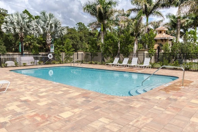 view of swimming pool with a patio