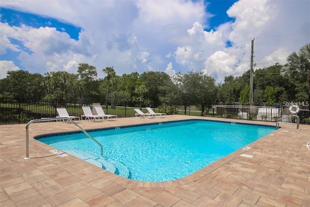 view of swimming pool featuring a patio