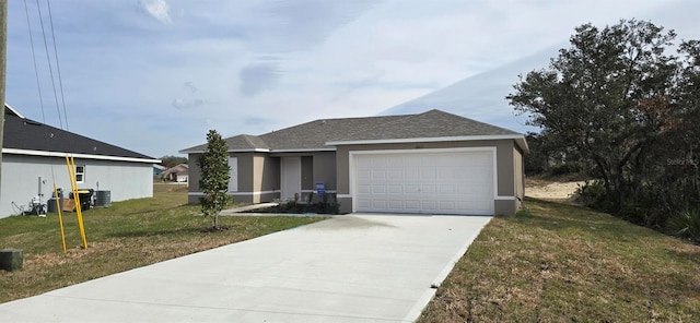 view of front of home featuring central AC unit, a front lawn, and a garage