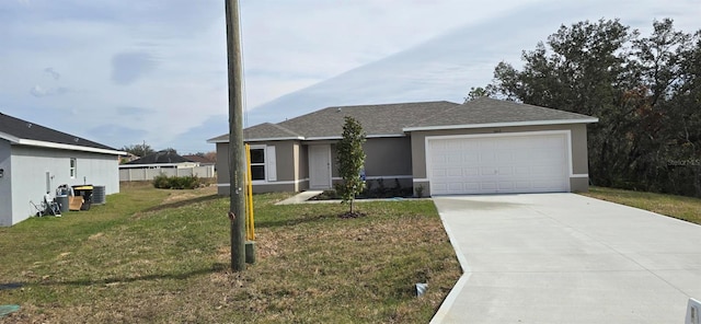 view of front of property with a garage and a front yard