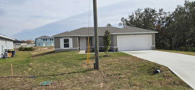 view of front facade featuring a front yard and a garage