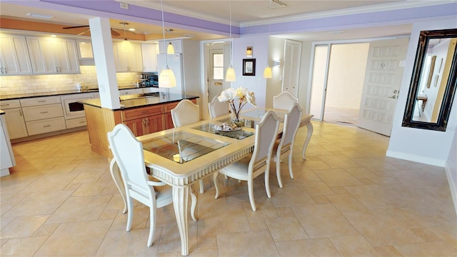 dining space featuring ornamental molding